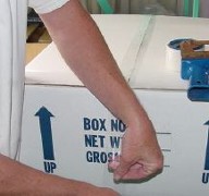 The sealed
        styrofoam box is placed in the cardboard box which is closed and sealed.